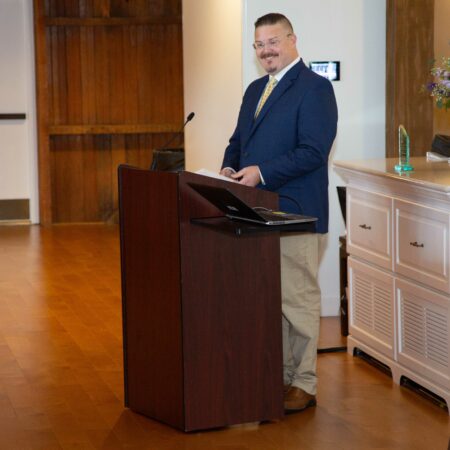 a person standing at a podium