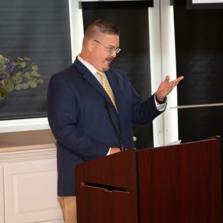 a person standing at a podium