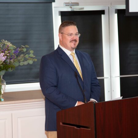 a person standing at a podium