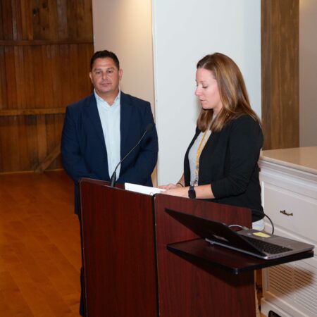 people standing at a podium