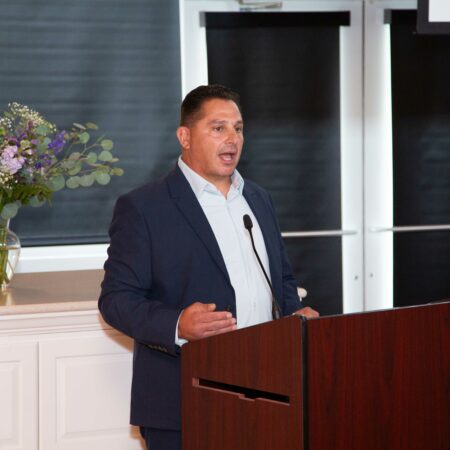 a person standing at a podium