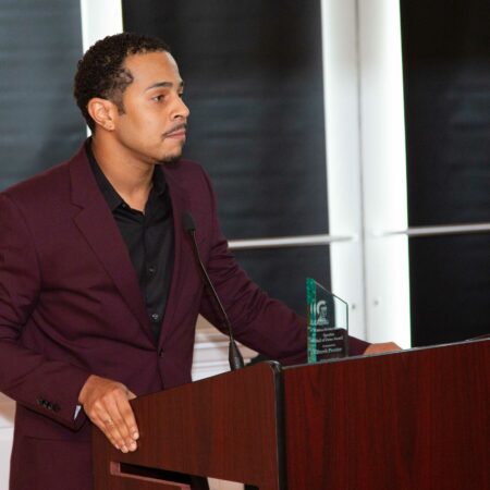 a person standing at a podium