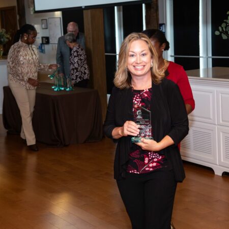 a person holding a trophy