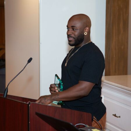 a person standing at a podium