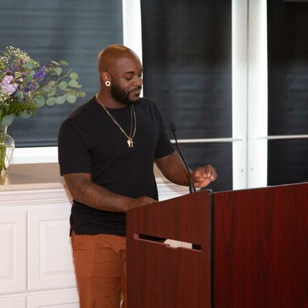 a person standing at a podium