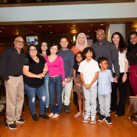 a group of people posing for a photo