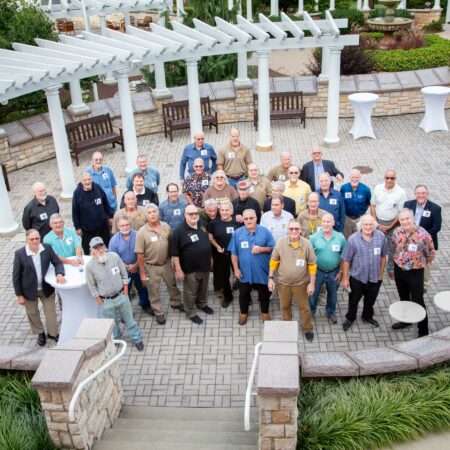 a group of people standing in a courtyard