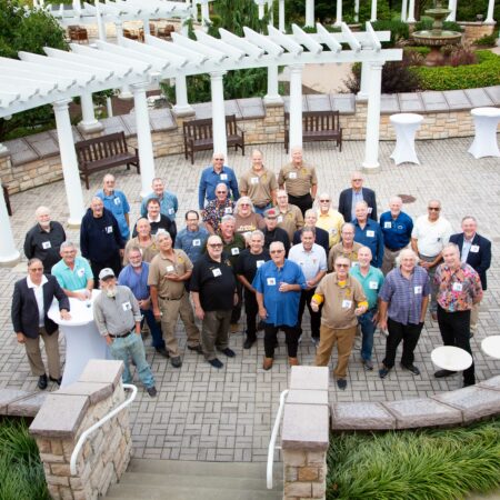 a group of people standing in a courtyard