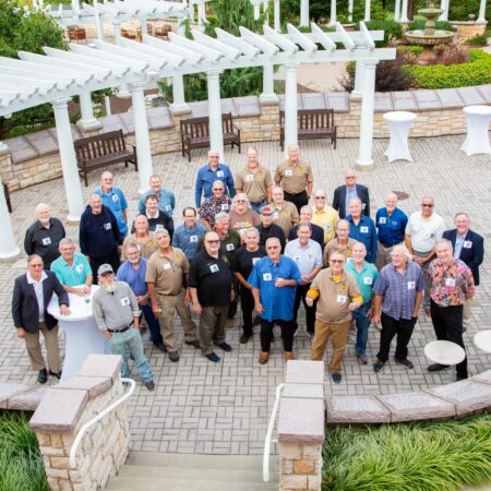 a group of people standing in a courtyard