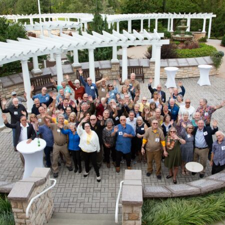 a group of people standing in a courtyard