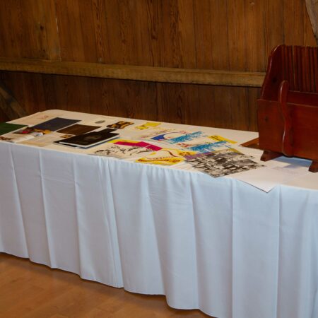 a table with white tablecloth and pictures on it