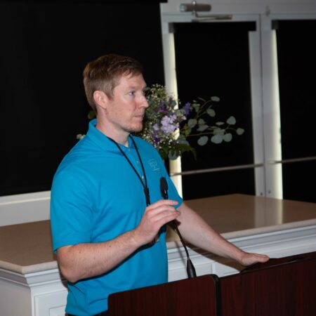 a person standing at a podium