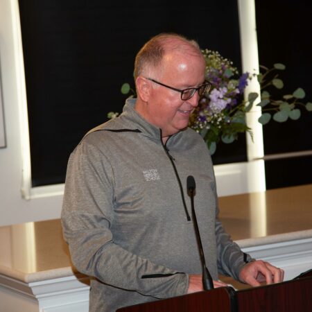 a person standing at a podium