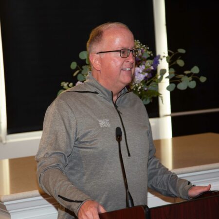 a person standing at a podium