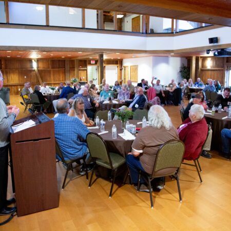 a group of people sitting at tables