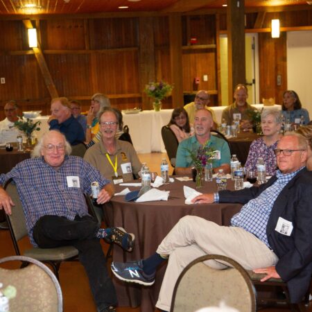 a group of people sitting at tables