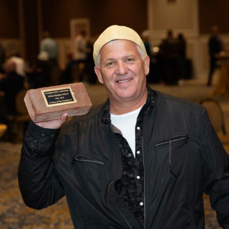 a person holding a plaque