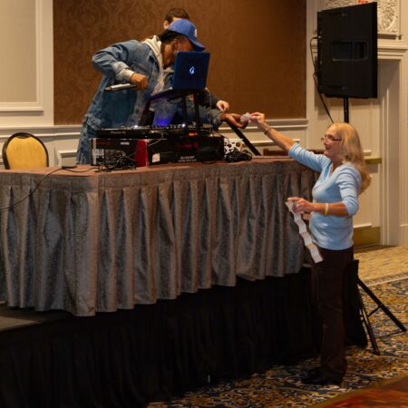 a person standing on a table with a person on it