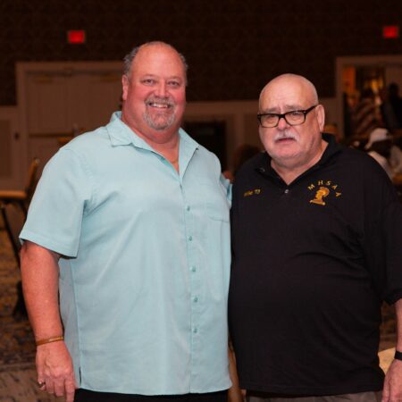 a couple of men standing together