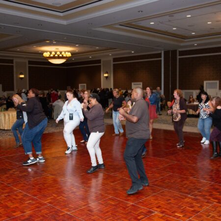 a group of people dancing in a room