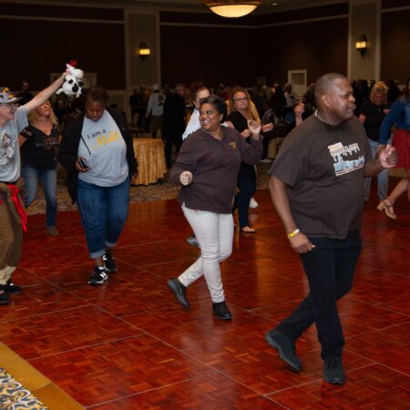 a group of people dancing in a room