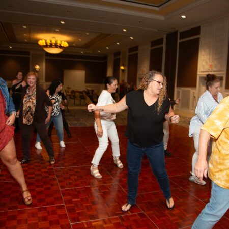 a group of people dancing in a room