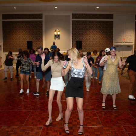 a group of women dancing in a room