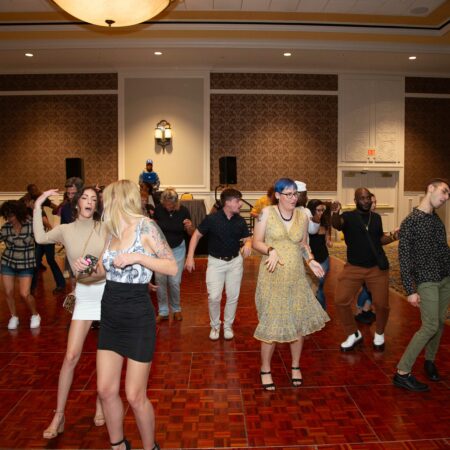 a group of people dancing in a room