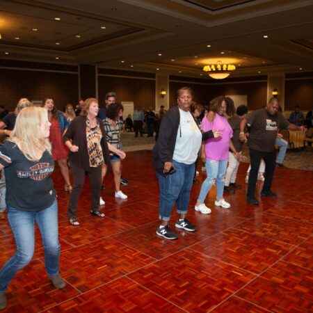 a group of people dancing in a room