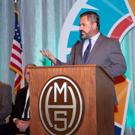 a person standing at a podium