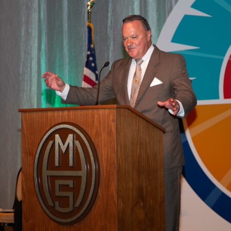 a person standing at a podium