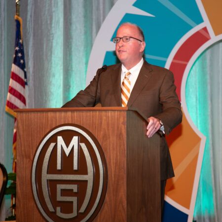 a person standing at a podium