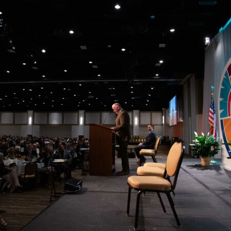 a person standing at a podium