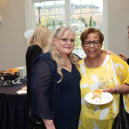 two women standing next to each other
