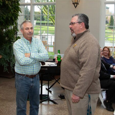 a person standing next to another person