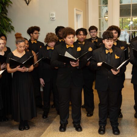 a group of people singing in a choir