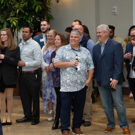 a group of people standing in a room