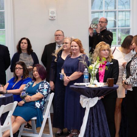 a group of people standing in a room