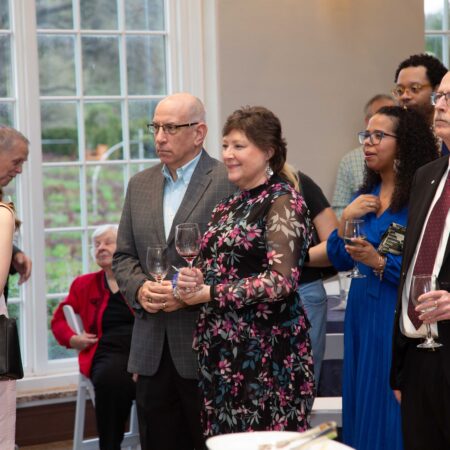 a group of people standing in a room