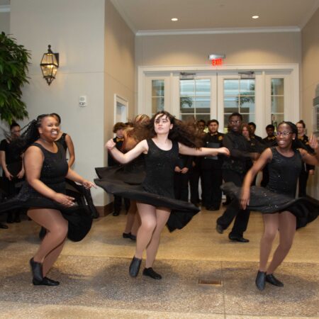 a group of women dancing in a room
