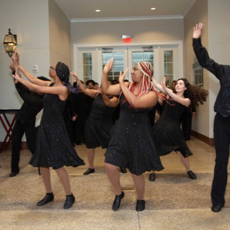a group of people dancing in a room