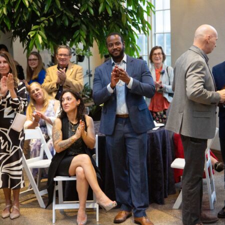 a group of people clapping