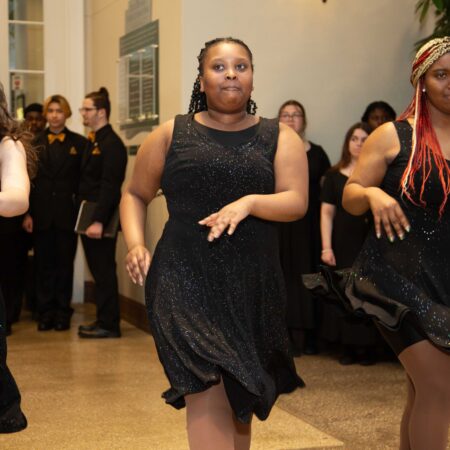 a person in a black dress dancing