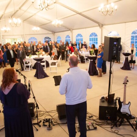 a person standing in front of a crowd of people