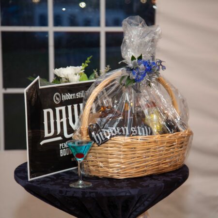 a basket and a glass of wine