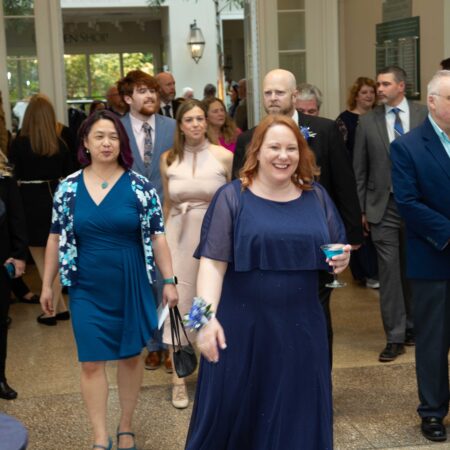a group of people walking in a room