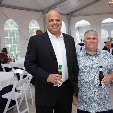 a person holding a bottle of beer