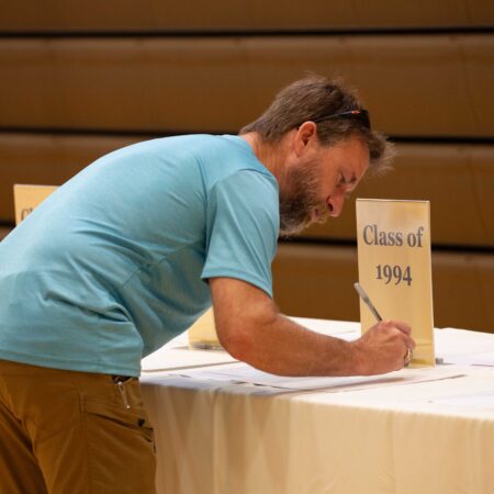a person writing on a paper