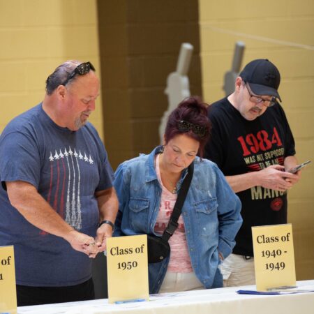 a group of people voting at a table