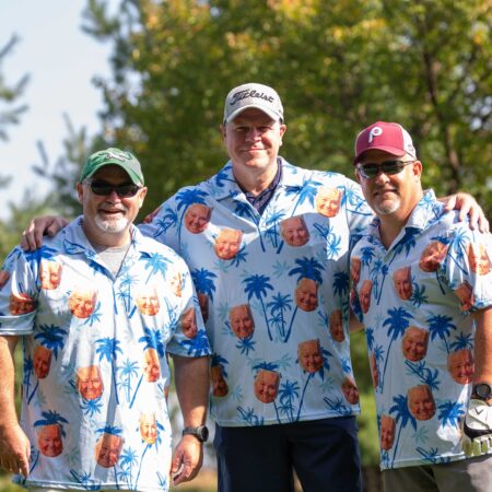 a group of men wearing matching shirts